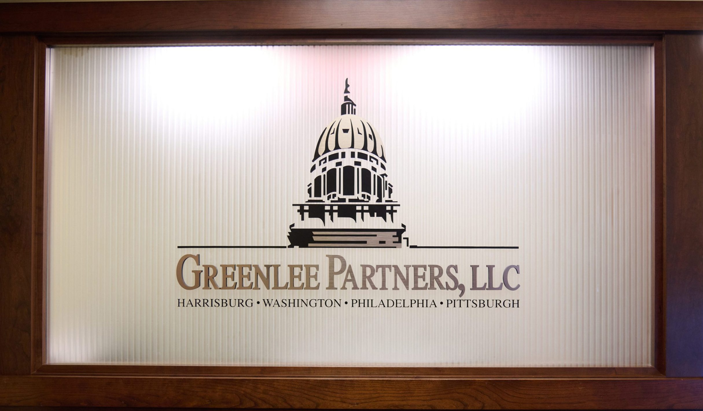 Greenlee-Partners-Reception-Sign-scaled-e1737726992859